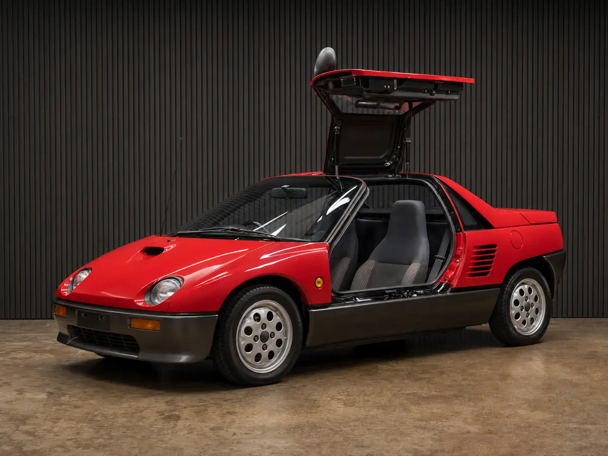 Red Autozam AZ-1 PG6SA kei coupe with a gullwing door open