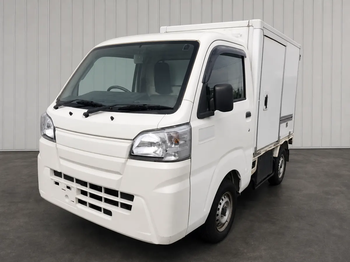2019 Daihatsu Hijet S500P refrigerated kei box truck front three-quarter studio reference