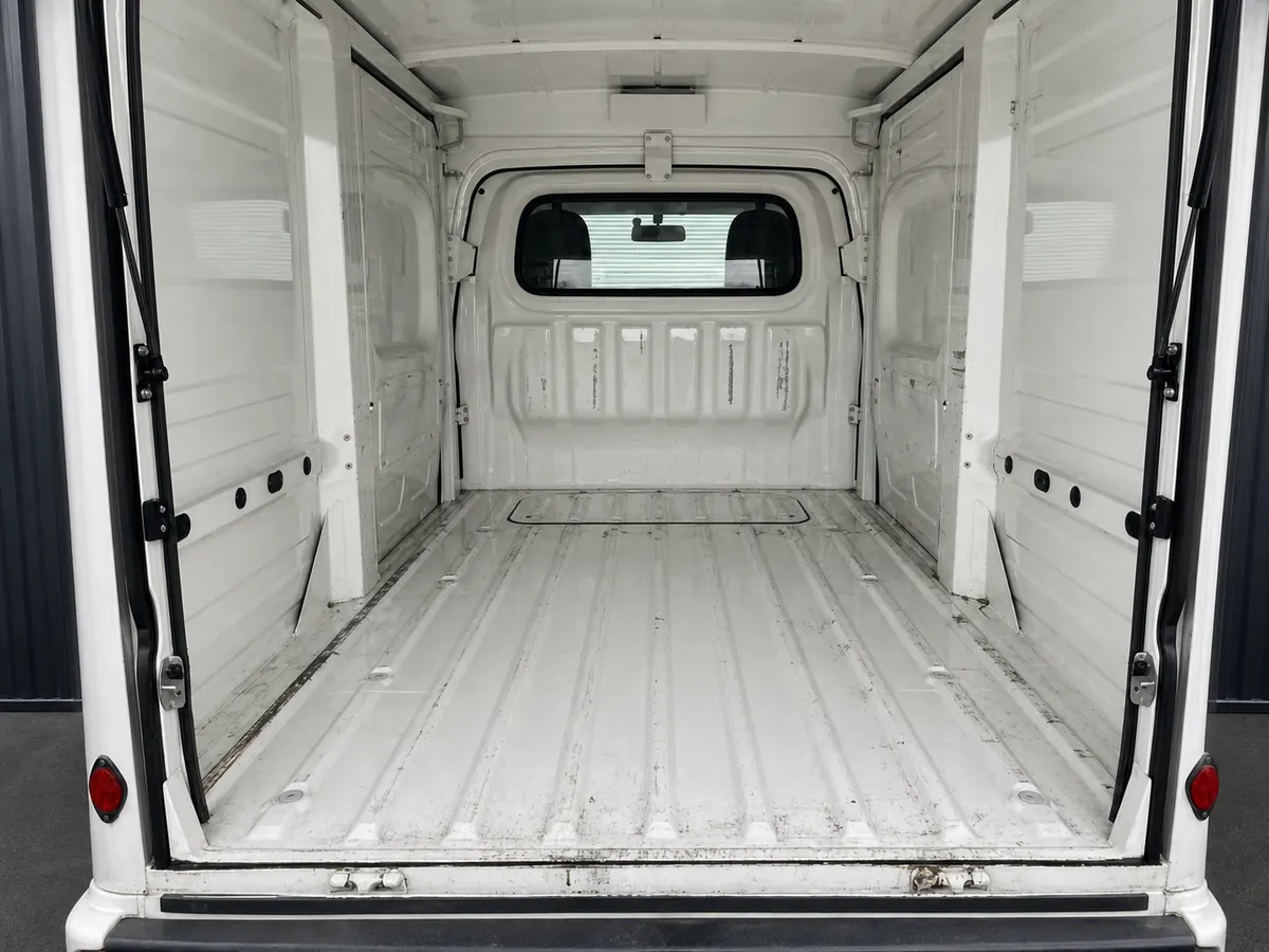 Clean interior of a tall ribbed enclosed cargo box on a kei truck