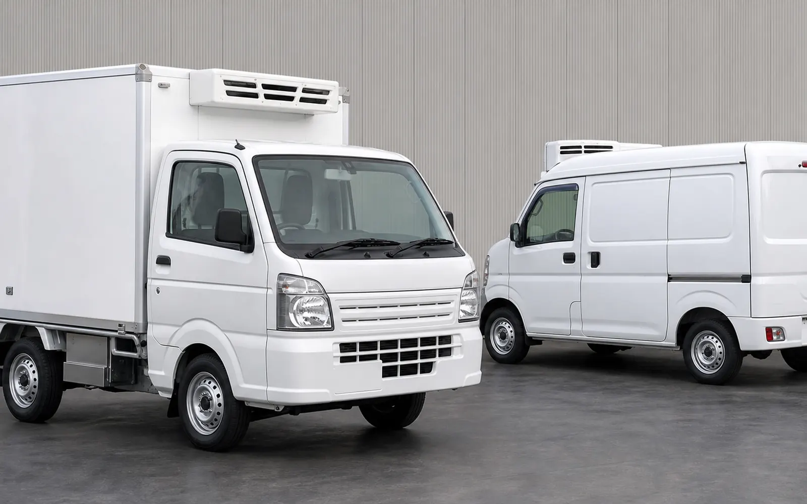Refrigerated Japanese kei box truck and temperature-controlled kei cargo van in a clean studio