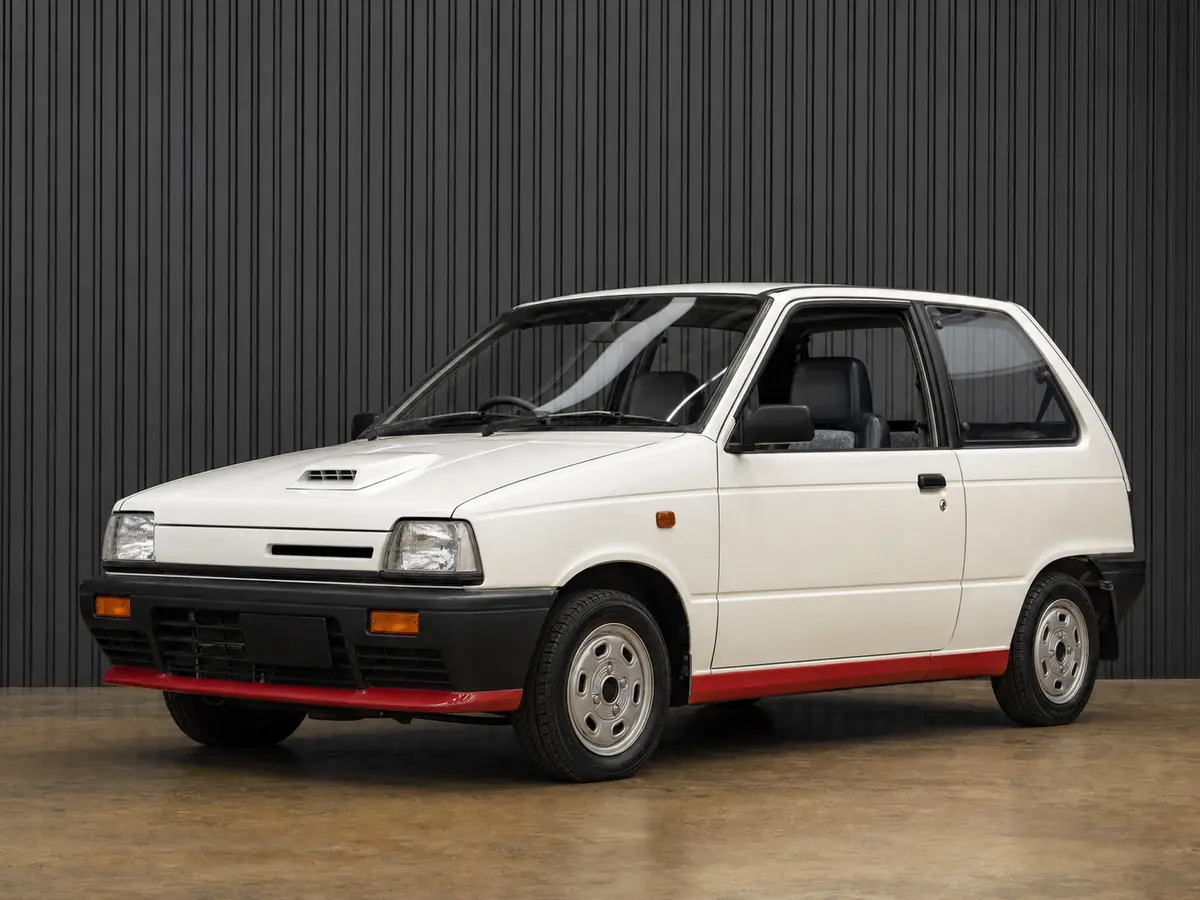 White first-generation Suzuki Alto Works CC72V turbo kei hatchback