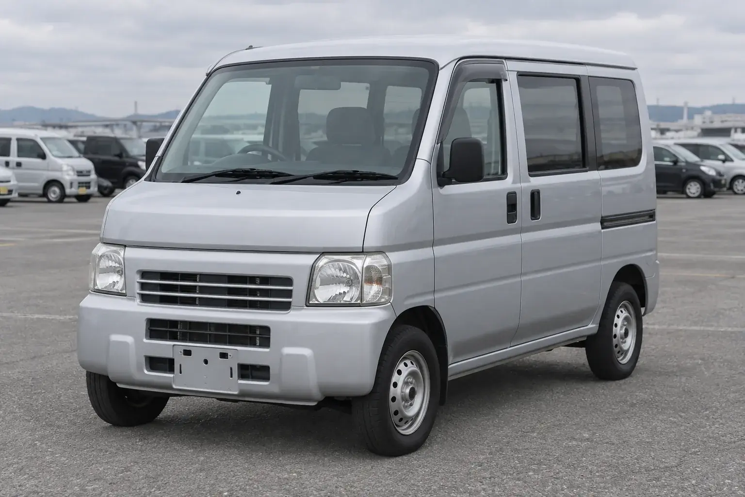 Silver Honda Vamos HM1 kei van, front three-quarter view illustration