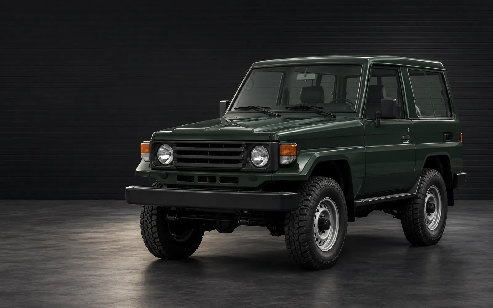Land Cruiser 70 Series heavy-duty short-wheelbase vehicle in a dark studio
