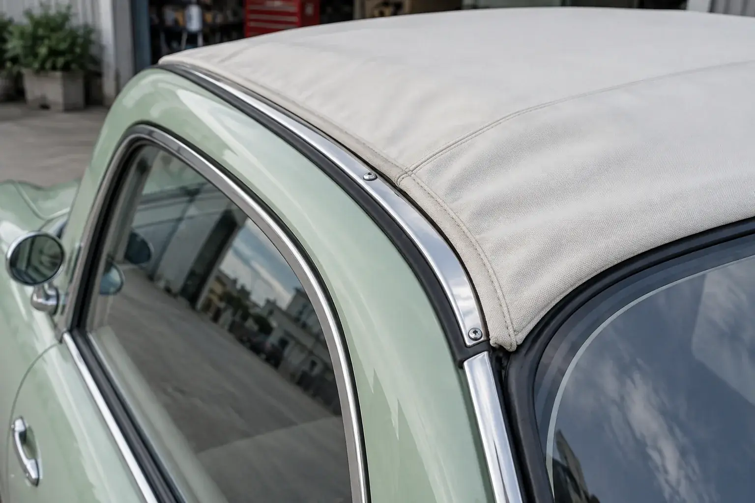 Canvas roof edge, chrome trim and weatherstrip to check for leaks on a Nissan Figaro