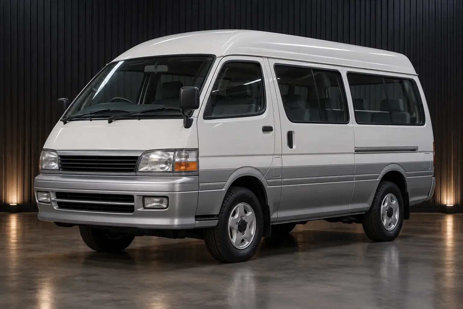 Silver Toyota Hiace H100 4WD van, front three-quarter view illustration