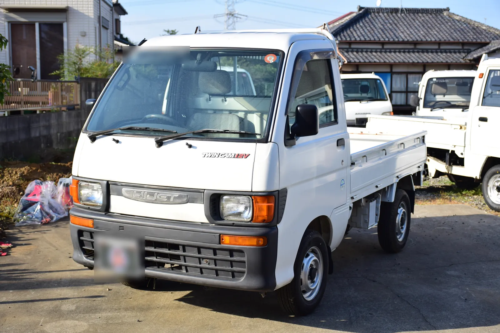 Daihatsu Hijet S100P kei truck at the Mirai yard