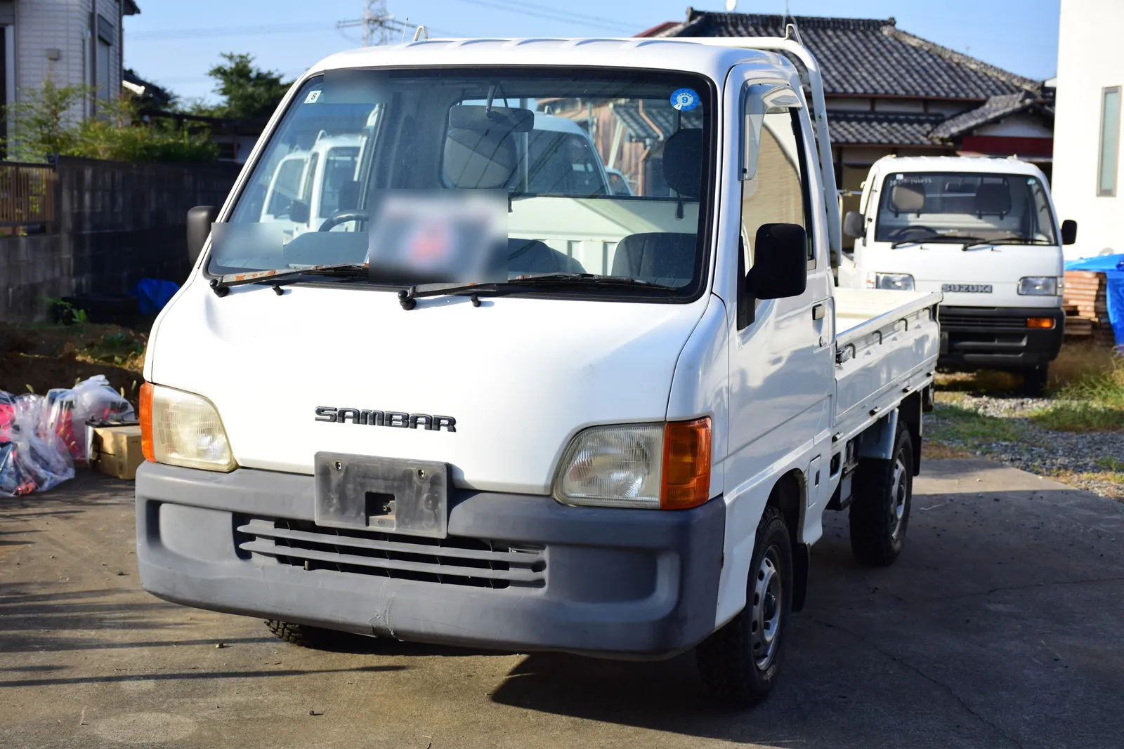 Later Subaru Sambar TT2 kei truck at the Mirai yard